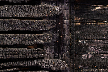 wall charred boards after fire