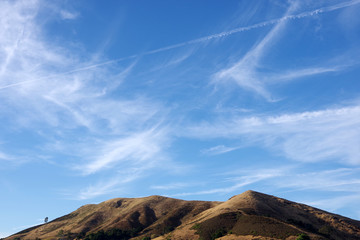 Close view of a strong blue central California evening sky with vivid clouds