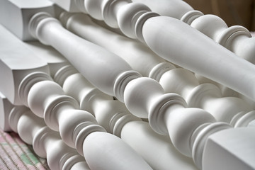 Balusters process production. Solid wood balusters before finishing. Furniture manufacture. Close-up