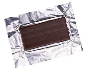 Dark chocolate bar in foil isolated on white background, top view.