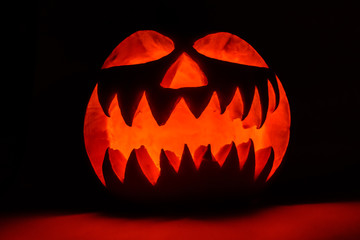 Spooky halloween pumpkin on a black background