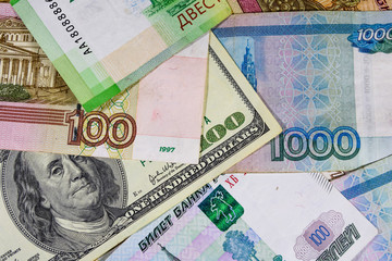 American one hundred dollars banknote on the many russian rubles