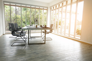 Desks with PCs in bright and modern open space office