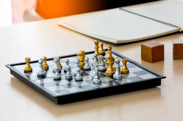 Close-Up Of Chess Pieces On Wooden Table