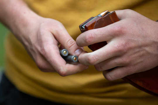 The Guy Loads The Cartridges In The Machine Gun Store