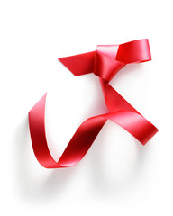 Red ribbon on a white background.
