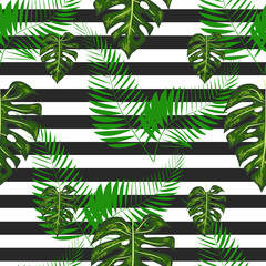 Exotic summer print. Seamless stripe pattern with tropical leaves. Jungle background.