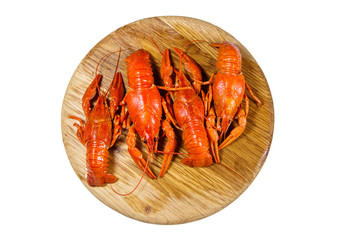 Boiled crayfish on wooden cutting board isolated on white background