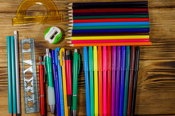 Set of school stationery supplies on a wooden desk. Back to school concept
