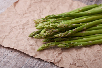 Seasonal product fresh green Asparagus on dark background