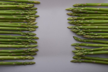 Seasonal product fresh green Asparagus on dark background