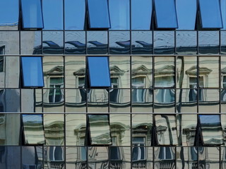 Buildings reflected In another building