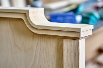 Wooden headboard building process. Wooden furniture manufacturing process. Furniture manufacture. Close-up