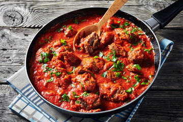close-up of African Beef Stew in tomato sauce - obrazy, fototapety, plakaty