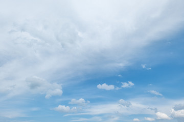 Sky background with fluffy clouds