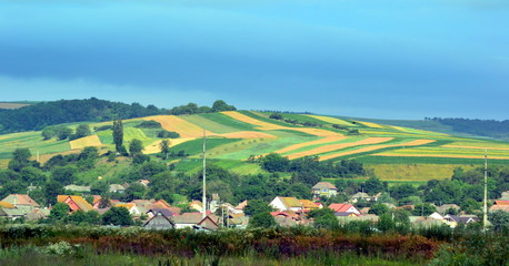 Fototapeta na wymiar rural landscape with a village and hills in Transylvania