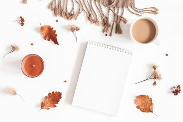 Autumn composition. Cup of coffee, plaid, notepad, autumn leaves on white background. Flat lay, top view, copy space
