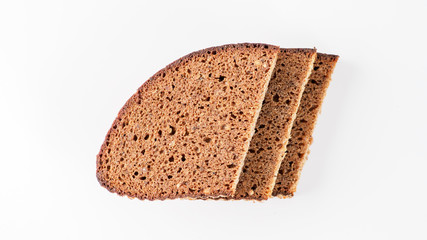 Sliced black bread on white background.