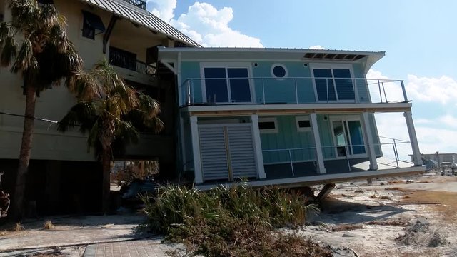 A home completely swept away by Hurricane Michael slammed into an apartment in Mexico Beach, Florida, 2018