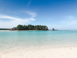 beautiful atoll with luxury resort in a tropical seascape