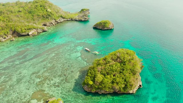 Turquoise lagoon with rocky island and corall reef, aerial view Boracay, Philippines. Summer and travel vacation concept.