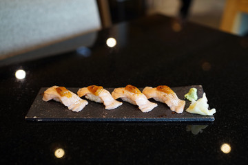 Grilled salmon sushi - Set of salmon aburi sushi topped with sweet sauce, Traditional Japanese Food.