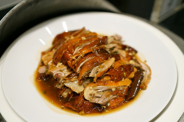 Grilled Peking duck - A plate of homemade roasted duck, Chinese food style.