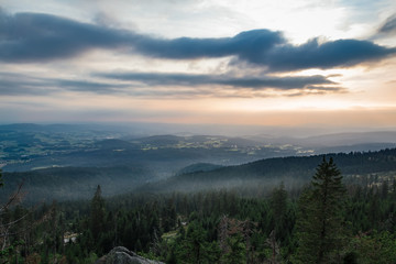 Fototapeta na wymiar Nice sunset from hill Tristolicnik with fog, Sumava National Park and Bavarian Forest, Czech republic and Germany