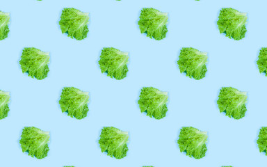 Pattern of fresh Green lettuce on blue background. Top view. Summer concept. Collage