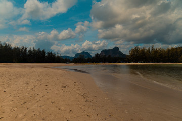 Standing on the beach looking at the differents clouds.