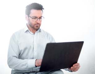 close up.modern businessman is using a laptop.