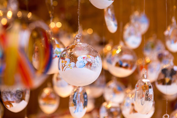 Christmas souvenirs on the counter in Europe, Painted glass Christmas balls with fairy tales.