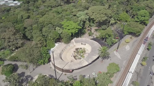 Beautiful slow tilting shot of metro train and Botanical garden; Medellin, Colombia, Parque Explora, Jardin Botanico
