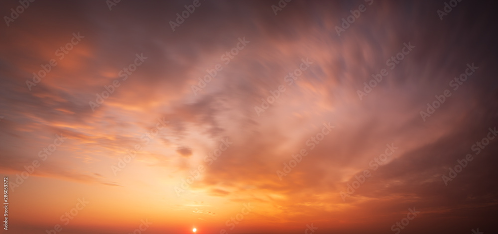 Wall mural fiery sunset, colorful clouds in the sky