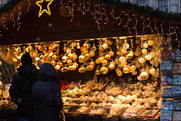 Christmas souvenirs on the counter in Europe, Painted glass Christmas balls with fairy tales.