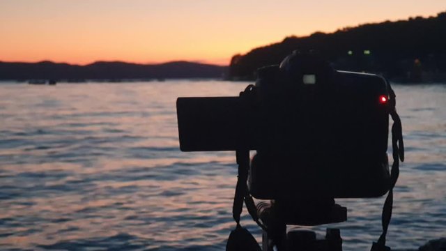 Timelapse Harbor and beach line. Taking timelaps video at golden hours on the beach with professional camera in manual mode.