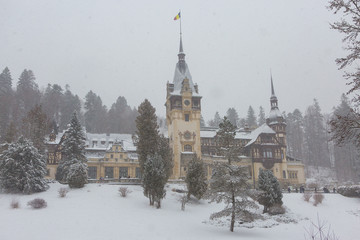 Fototapeta na wymiar Peles Castle in Romania Predeal, blizzard in Brasov Sinaia