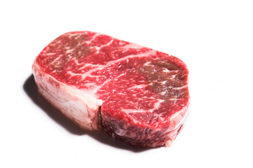 Fresh raw marble beef steak on background