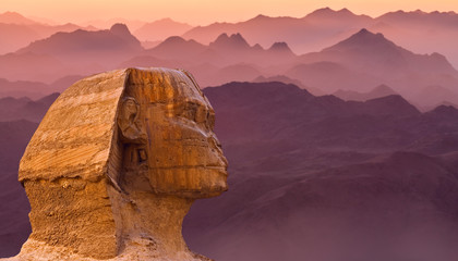 Fototapeta na wymiar Sphinx against the backdrop of the great Egyptian pyramids. Africa, Giza Plateau. 