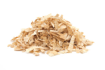 A pile of yellow sawdust wood pieces on a white background - obrazy, fototapety, plakaty