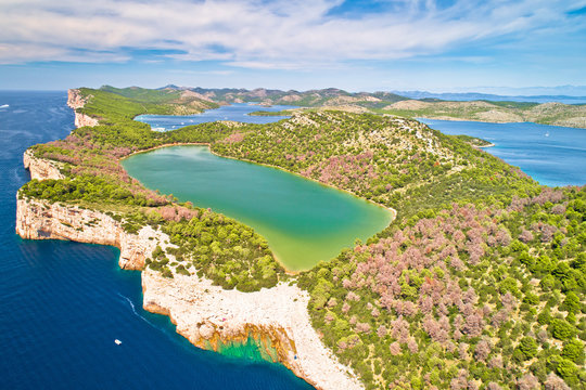 Telascica nature park cliffs and green Mir lake on Dugi Otok island aerial view
