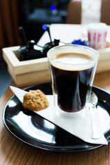 Americano black coffee in glass on table
