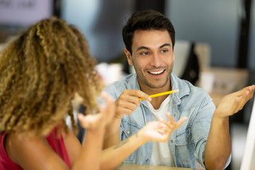 portrait of man discussing with women in office