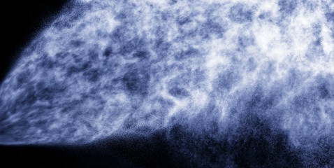 A stream of water and a cloud of drops