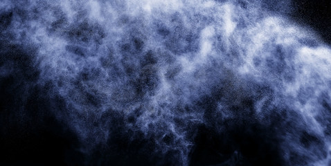 A stream of water and a cloud of drops