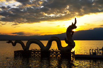 Sunset beautiful and silhouette of statue dragon