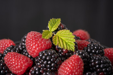 Background from fresh organic blackberries and raspberries,. Close up blackberry and raspberry
