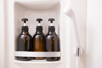 toiletry bag with travel toiletries, small plastic bottles of hygiene products and soap, Hotel Guest Room Supplies