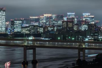 Fototapeta na wymiar Panoramic modern city skyline bird eye aerial view of Tokyo bay under rainy night