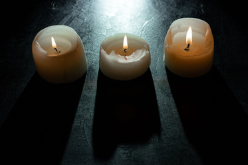mourning candles on black background